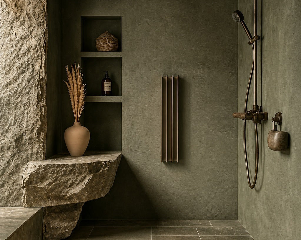Modern shower setup with stone wall, shelves, and decorative elements in a bathroom.